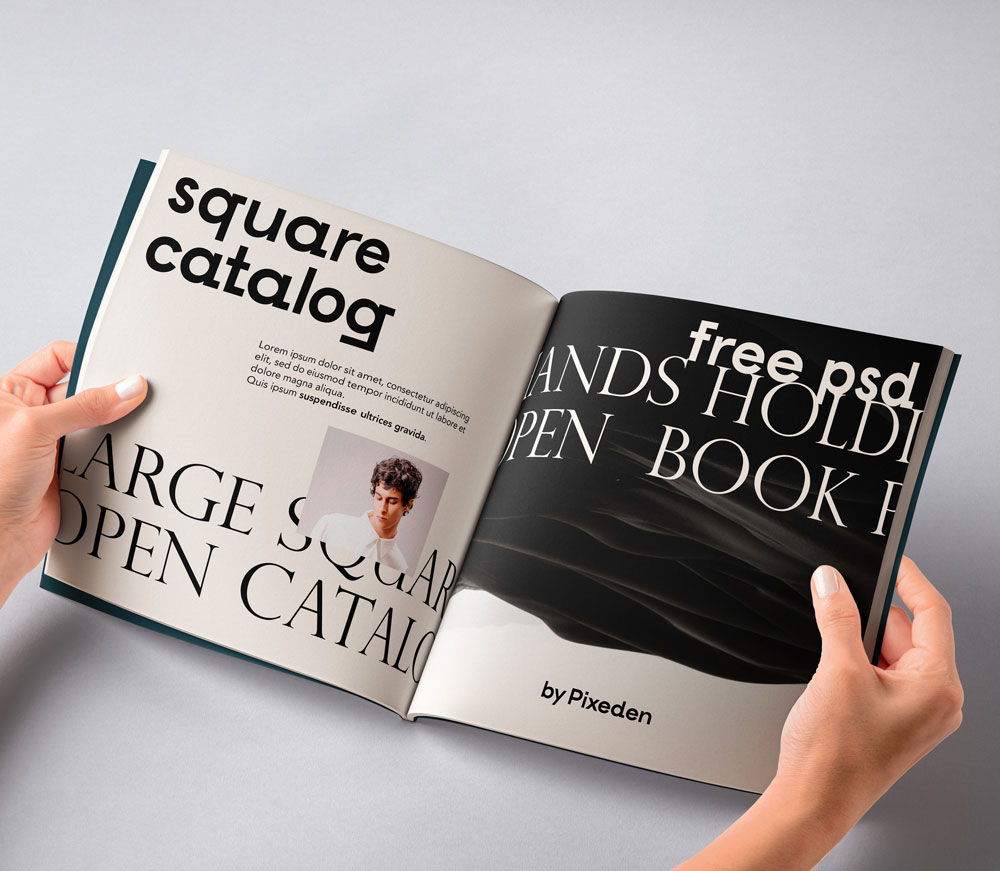 Free Hand Holding Square Magazine Mockup PSD