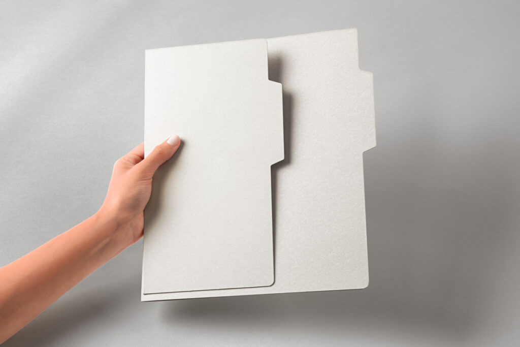 Free Hand Holding Folder Mockup PSD | Mockupful