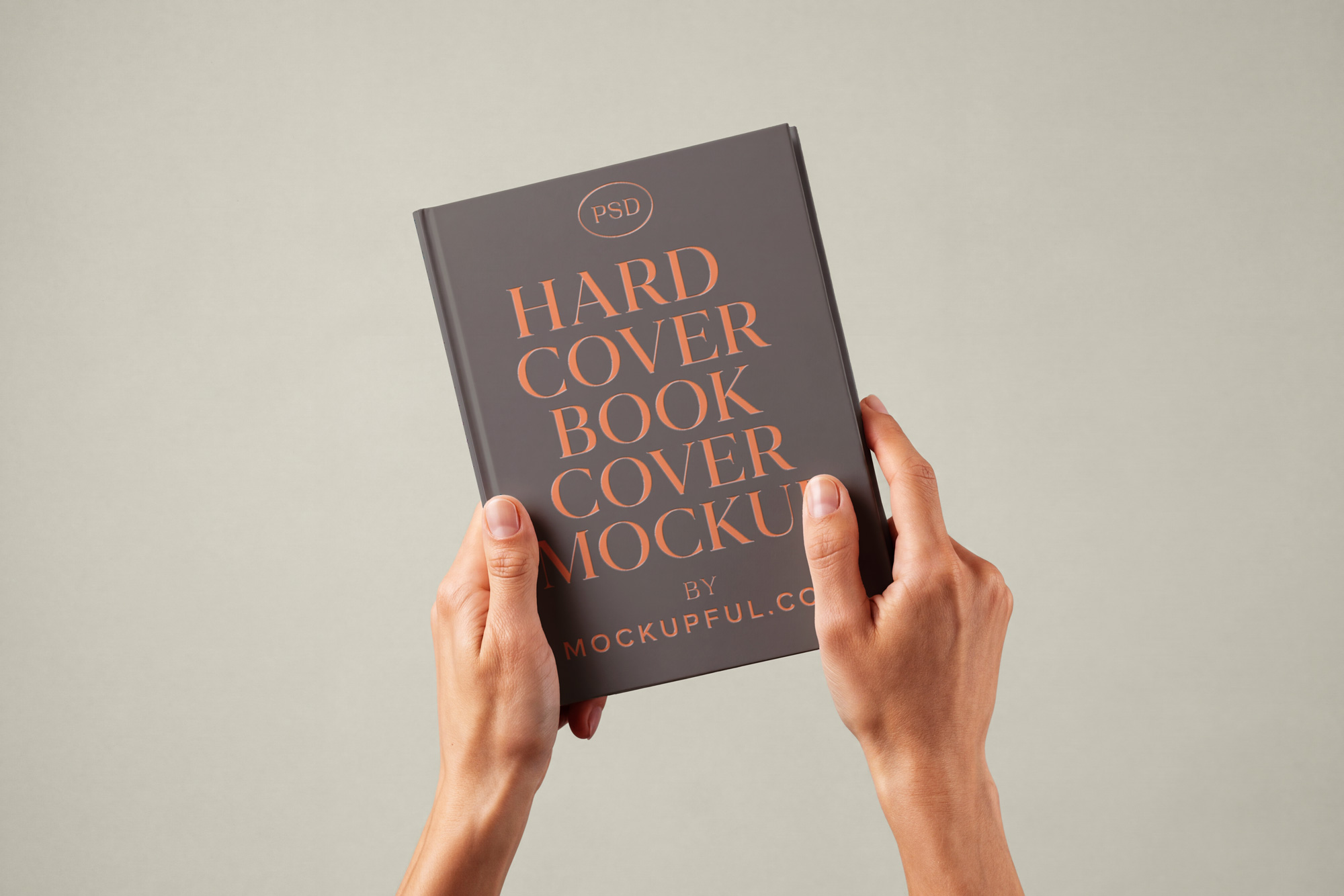 Free Hand Holding Hardcover Book Mockup