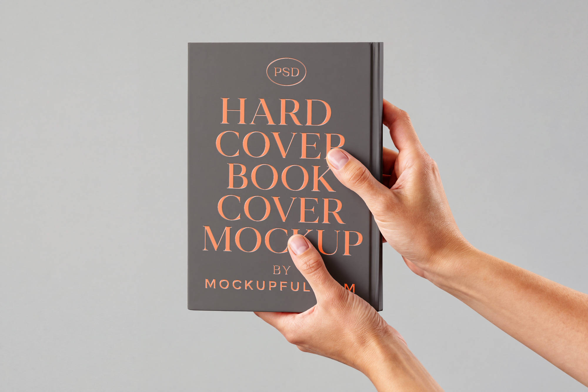 Free Hand Holding Hardcover Book Mockup